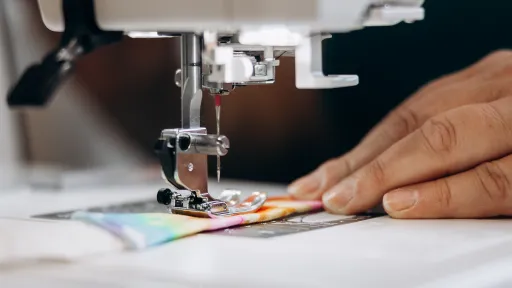 Close up image of sewing machine needle and strap 